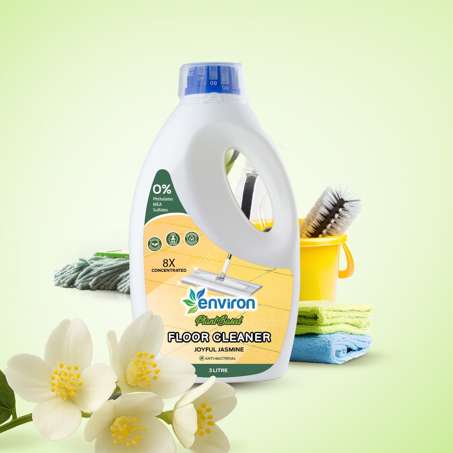 Environ floor cleaner bottle with cleaning tools and flowers on a light green background