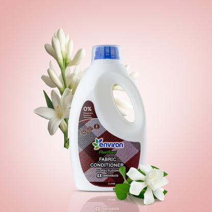 Fabric conditioner bottle with flowers on a pink background